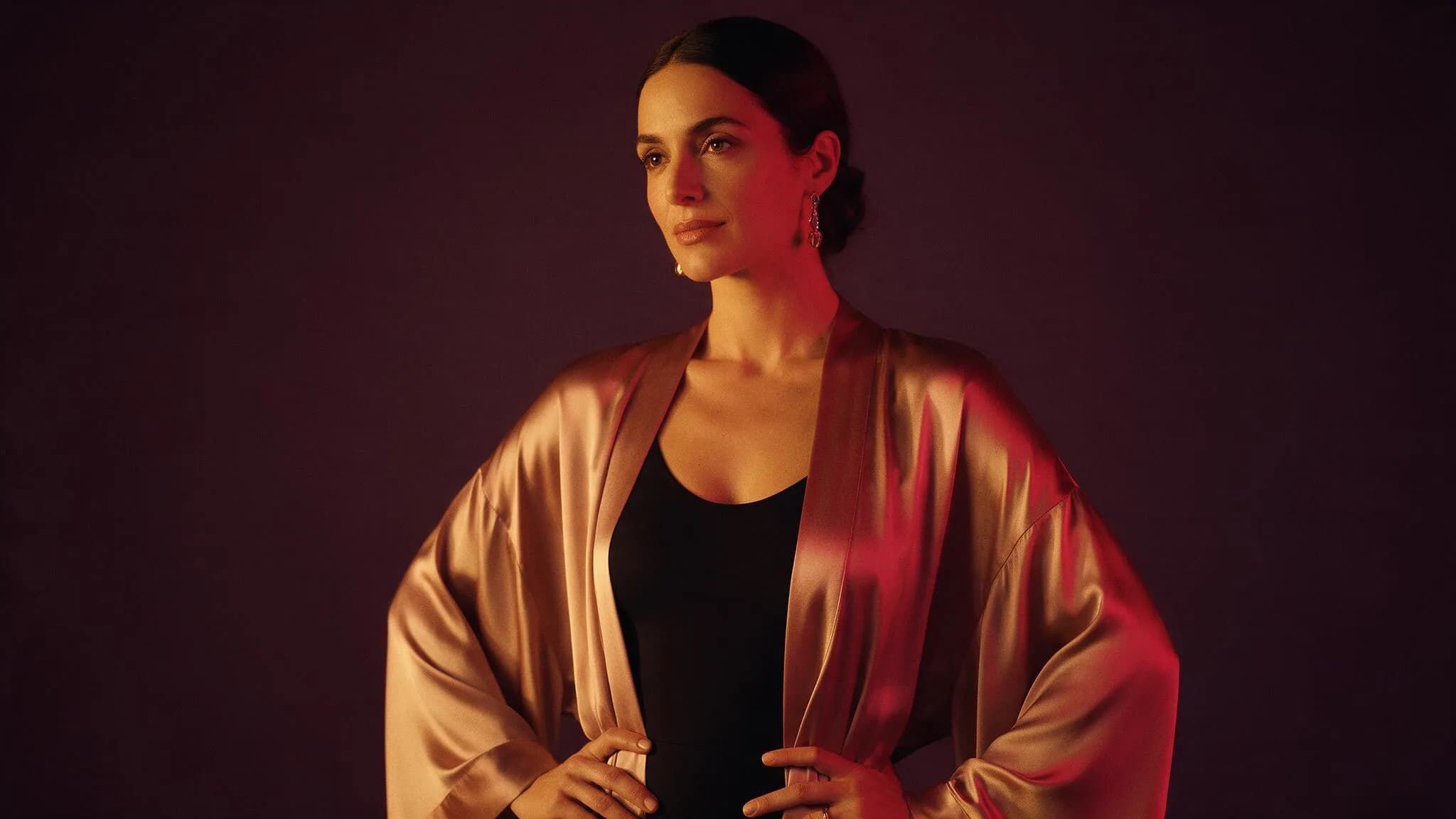 Fictional adult model in warm studio light, used as a text-to-image prompt